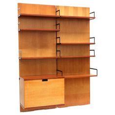 a wooden bookcase with two drawers on each side