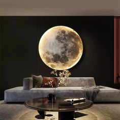 a living room with a large moon on the wall