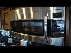 a stainless steel microwave oven in a kitchen