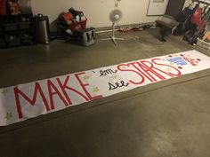 a sign that says make stars and see stars on the floor in front of a garage