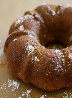 a chocolate bundt cake with powdered sugar on top