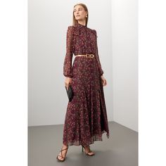 Red floral cotton (100% Silk). Lining (100% Polyester). A-line. Long sleeves. Mock neck. Back zipper closure. 55" from shoulder to hemline. Imported. Feminine A-line Maxi Dress For Fall, Burgundy Floral Print Dress For Spring, Chic Burgundy Maxi Dress For Fall, Red Floral Print Midi Dress For Fall, Red Floral Print Maxi Dress For Fall, Elegant A-line Floral Dress For Fall, Formal Floral Print Maxi Dress For Fall, Formal Fall Floral Print Maxi Dress, Red Maxi Dress For Workwear In Fall