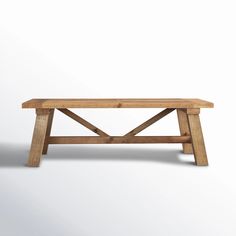 a wooden bench sitting on top of a white floor