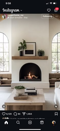 a living room filled with furniture and a fire place in front of a tv mounted on a wall