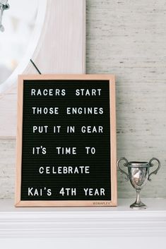 a sign that reads racers start those engines put it in gear its time to celebrate ka's 4th year