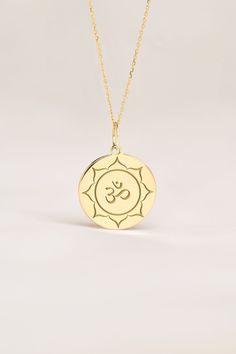 Om represents yoga, spirituality, and peace in body, in mid and spirit. This pendant is a meaningful gift for Birthdays, Anniversaries and Weddings. ● 14K SOLID GOLD ● FREE BACK SIDE PERSONALIZATION ● FREE SHIPPING  ● Inner diameter of the jump ring is 4mm ● Pendant thickness is 0.5mm 🇺🇸 All items are HANDMADE IN USA 🇺🇸 All materials are sourced from USA ● Chain Length Options    - Without Chain    - 40 cm / 16 inches    - 45 cm / 18 inches    - 50 cm / 20 inches ● Pendant Size Options    - Spiritual Engraved Round Charm Necklaces, Engraved Symbolic Necklace For Meditation, Symbolic Necklaces For Meditation And Festivals, Spiritual Birth Flower Pendant Charm Necklace, Spiritual Birth Flower Pendant Necklace, Spiritual Personalized Medallion Charm Necklaces, Spiritual Personalized Medallion Charm Necklace, Spiritual Round Necklace, Cadmium-free, Spiritual Medallion Charm Necklace Gift