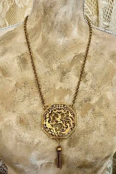 "Vintage Lisner Lion Filagree Necklace            730 20\" Gold Tone Round Link Chain with Hook Clasp and 3.5\" Extender. 2\" Gold Tone Lion and Phoenix Octagon Shaped Pendant with tassel, marked: LISNER Beautiful details. In great vintage condition Some signs of wear. Such a majestic looking Lion You will love it!! $190.00 Please note: Vintage in my shop means-Sold \"As Is\". Vintage implies \"previously worn\" and may need repair or cleaning. All sales final. Enjoy All sales final!" Geometric Necklace, Hook Clasp, Link Chain, Vintage Necklace, Phoenix, Jewelry Necklace Pendant, Lion, Gold Tones, Gold Necklace