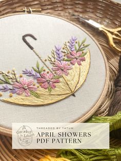 an embroidery project with flowers on it and the words,'march is april showers '