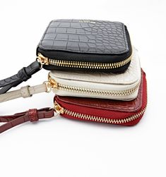 An adorable mini wristlet you can loop around your arm wherever you go. Your new out on the town go-to is made to carry what's important. It can fit your ID, cash, cards, and even a mini lipstick. With three classic colors in rich tones you'll be able to find the perfect match for your outfit.

Detachable wrist strap
Easy to clean vegan leather
Zip around closure Adjustable Rectangular Wristlet Mobile Phone Bag, Adjustable Rectangular Wristlet For Mobile Phone, Mini Lipstick, Clean Vegan, Sunflower Necklace, Meaningful Jewelry, Midnight Black, Jewelry Pouch, Jewelry Bags