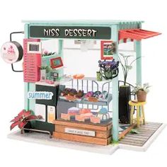 a miniature model of a dessert stand with lots of items on it's display