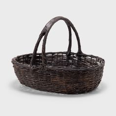 an old wicker basket with handles on a white background photo - free stock photo