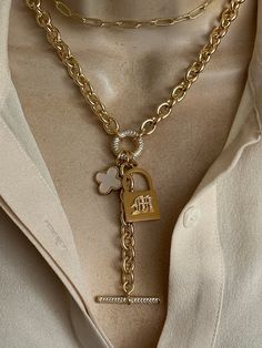 This personalized necklace features a gold plated stainless steel padlock with your choice of one initial in CZ old English font(choose at the checkout). Mother of pearl clover and CZ toggle chain drop add a modern twist to this necklace. Chunky oval link chain is gold plated over stainless steel. Drop toggle length is approximately 3 inches. Necklace length is adjustable 18-20 inches.  🎁All orders are shipped in a box. Gift messages are attached to the box. English Font, Old English Font, Toggle Necklace, Charm Necklaces, Box Gift, Personalized Necklace, Necklace Length, Link Chain, Bedroom Ideas