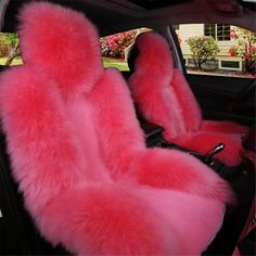 the interior of a car with pink fur