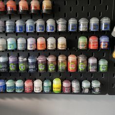 there are many different colors of paint on the wall in this display case, and it's easy to put together