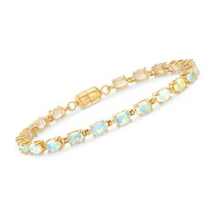 Ross-Simons is the authority on luxury classics. An all-time favorite gemstone in an all-time classic silhouette. This tennis bracelet lines up twenty 6x4mm oval Ethiopian opal cabochons in 18kt yellow gold over sterling silver. Magnetic clasp, opal tennis bracelet. Each Ross-Simons item arrives in a fine jewelry presentation box. Shop Ross-Simons jewelry risk-free as all items include a 30-day, 100% money-back guarantee. Stone Information Gem Type 1: Opal Stone Cut 1: Cabochon Stone Color 1: Wh Opal Birthstone, Opal Wedding, Fine Jewelery, Natural Gold, Sapphire Bracelet, Pearl Hoop Earrings, Opal Bracelet, Cz Stud Earrings, Fine Jewelry Bracelets