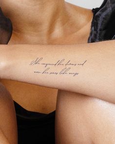 a woman with a tattoo on her arm that says, she is my favorite friend