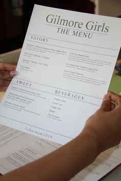 a person holding a menu in their hand