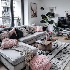 a living room filled with lots of furniture and decor