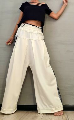 "New collection Avant Garde Loose Pants, Harem Pants Women, Extravagant Cotton Pants, Casual Pants, Punk Pants, Loose Pants ❤️ Extravagant designs and high quality fabrics! ❤️ Materials & Care Cotton Hand wash at low temperatures. Do not machine dry. Do not iron. Do not dry clean! ❤️ Sizing We can make your piece from XS to 5XL! Everything in the shop can be also made according to your measures free of charge! ❤️ Shipping ✈ Ready to ship The time I need to prepare an order for shipping varie