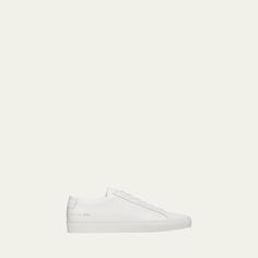 Common Projects low-top sneaker in soft leather. Runs large; consider ordering one size down. 1" platform heel. Round toe. Lace-up front. Golden embossed numbers at heel. Rubber outsole. "Achilles" is made in Italy. White Solomons Shoes, White Low-top Leather Sneakers, Common Projects Achilles Low, White Leather Fade-resistant Sneakers, White Non-slip Leather Sneakers, Common Projects Men, Balenciaga Trainers, Balenciaga Mens, Common Projects