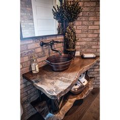 a bathroom sink sitting on top of a wooden counter