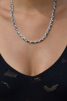 A silver plated brass oval and link chain with 100% cotton embroidery thread braided detail. The chain is designed with a clasp at each end to be worn in multiple ways. The style can be worn as a necklace, a mask chain or a wrap bracelet (depending on the size of the wrist). By attaching each clasp to the ear loops of a mask, the mask conveniently hangs around your neck when used with the chain. Details: Silver plated brass oval and link chain 100% cotton embroidery thread braid in black, gray, Sterling Silver Clasp Chain Necklace, Mask Chain, Braided Necklace, Cotton Embroidery, Hand Screen Printed, Ear Loop, Individual Style, Embroidery Thread, Men's Collection