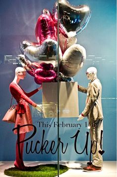 two mannequins in front of a display window with balloons and the words this february 1, picker up