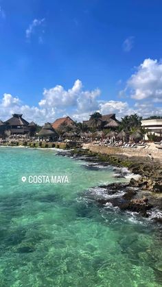 the beach and ocean in costa mayoa, mexico with houses on the other side