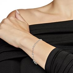 Discover the elegance of our Dancing Diamond Bracelet, a handcrafted masterpiece featuring laser-drilled round rose-cut diamonds. Its refined design ensures it seamlessly integrates into your everyday wardrobe. This versatile piece pairs beautifully with any outfit and is especially stunning when matched with our Rose-Cut Diamond necklaces for a coordinated look. Details 18K White Gold, 1.46 Grams5.25 Carats of Diamonds Luxury Silver Diamond Bracelet With Rose Cut Diamonds, Diamond Cut Crystal Bracelets, Elegant Silver Diamond Bracelet With Rose Cut, Crystal Diamond Cut Bracelets, Formal Diamond Bracelet With Rose Cut Diamonds, Elegant Sterling Silver Crystal Bracelet As Gift, Luxury Rose Cut Diamond Bracelet As Gift, Luxury Rose Cut Diamond Bracelet Gift, Formal Rose Cut Diamond Bracelet