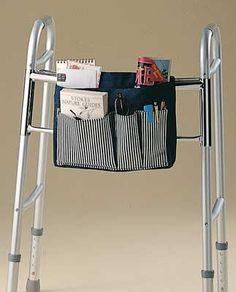 a small metal ladder with a bag hanging from it's side and two pockets on the back