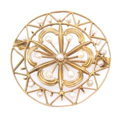 "This antique brooch, a Victorian piece from the late 1800s/early 1900s, is hand made of 10K yellow gold wire wrought in a perfect circle with radiate triangles inside -- an unmistakable image of the sun. Inside of the sun is a delicate rosette, beautifully accented with seed pearls. The pin mechanism would allow for the piece to be worn either as a brooch or, when suspended from a chain, as a pendant. DETAILS METAL: 10K Yellow Gold PEARLS: 20x natural pearls WEIGHT: 4.0g DIAMETER: 1.27\"	in sto Sun Motif, Perfect Circle, Gold Brooch, Antique Brooches, Diamond Cocktail Rings, Gold Brooches, A Perfect Circle, Seed Pearl, Gold Wire