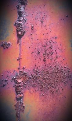 an old rusted metal surface with lots of dirt