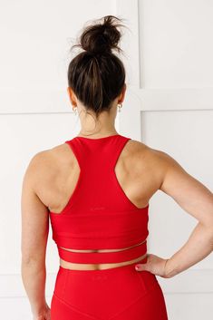 Introducing the Revive Crop - the perfect combination of style and function. Made with our soft ribbed fabric and 4-way stretch, this crop top is designed to keep you comfortable during your workouts. The built-in bra provides medium-impact support while the edgy and sleek cutout wraps around your midsection to accentuate the smallest part of your back, while still providing ample coverage.We listened to your requests and added more coverage than a typical crop, making it almost reach our High R Muscle Tank Tops, Crop Top Bra, Ribbed Leggings, New Launch, Sports Leggings, Ribbed Fabric, High Neckline, Bra Tops, Your Back