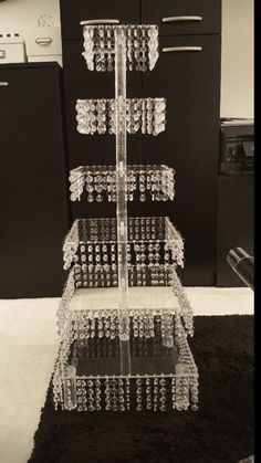 a three tiered display case in the middle of a kitchen