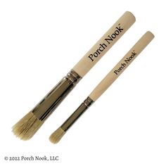 two wooden brushes sitting side by side on top of each other with the words porch nook written on them