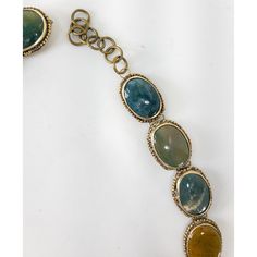 We are selling this interesting specimen stone belt. This belt is either Southwestern Navajo style or just Victorian and features 18 different cabochons of different types of specimen agate or jasper in silverplate mountings.  Condition: Good antique condition.  Dimensions: Length Unhooked 35 Inches 88.9 cm Width 1 1/4 Inches 3.3 cm Depth 1/4 Inches 1.0 cm Clasped Width 15 1/2 Inches 39.3 cm Adjustable Artisan Moss Agate Jewelry, Adjustable Moss Agate Artisan Jewelry, Bohemian Moss Agate Gemstone Jewelry, Artisan Jasper Jewelry In Oval Shape, Artisan Oval Jasper Jewelry, Vintage Jasper Jewelry With Natural Stones, Oval Jasper Cabochon Jewelry, Bohemian Multi-stone Oval Gemstones, Bohemian Oval Multi-stone Gemstones