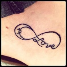 a tattoo with the word love on it