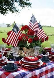 a table set with red, white and blue place settings