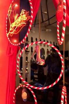 a window display with red and white striped decorations