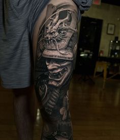 a man with a tattoo on his leg