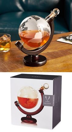 an image of a tea ball in a glass on top of a table next to a box