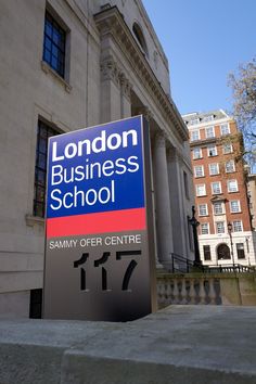 the london business school sign is displayed in front of an old building with large columns