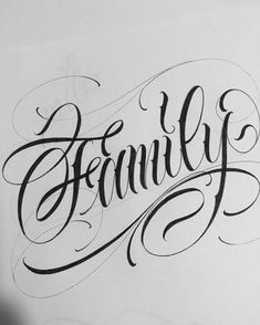 the word family written in cursive writing on a piece of paper with an ink pen