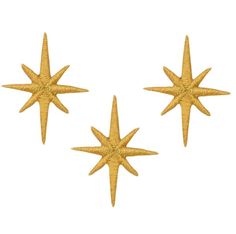 three gold starbursts on a white background