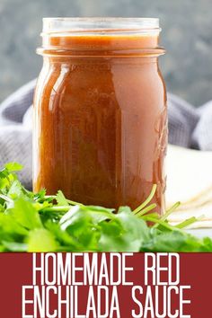 homemade red enchilada sauce in a mason jar with fresh parsley on the side