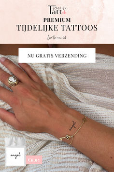 a woman's hand with a gold ring on it and the words tudel like tattoos