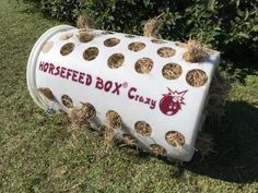 a large white box sitting in the grass