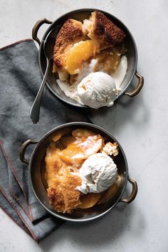 two pans filled with food sitting on top of a table