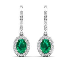 These exquisite oval emerald and diamond earrings are a stunning addition to any jewelry collection. The vibrant green emeralds are elegantly surrounded by sparkling diamonds, creating a luxurious and sophisticated look that is perfect for any special occasion. Metal: 14K Gold Setting Type: Prong Rhodium Finish: Yes, on White Gold Gemstone Details: Gemstone: Emerald Shape: Oval Average Dimensions: 7.00 x 5.00 MM Quantity: 02 Average Cut: Very Good Average Color: Medium to Dark Green Average Clar Fine Jewelry Oval Emerald Earrings, Oval Emerald Earrings For May Birthstone, Emerald Oval Earrings For May Birthstone, Green Oval Diamond Earrings, Green Oval Earrings With Diamond Accents, Emerald And Diamond Earrings, Dance Jewelry, Diamond Dangle Earrings, Birthstone Gifts