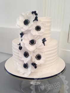 a white cake with black and white flowers on it